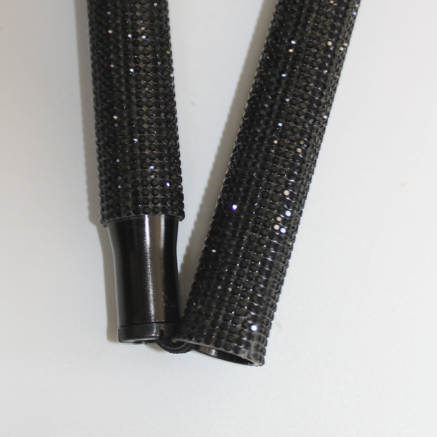 Two black textured rods 