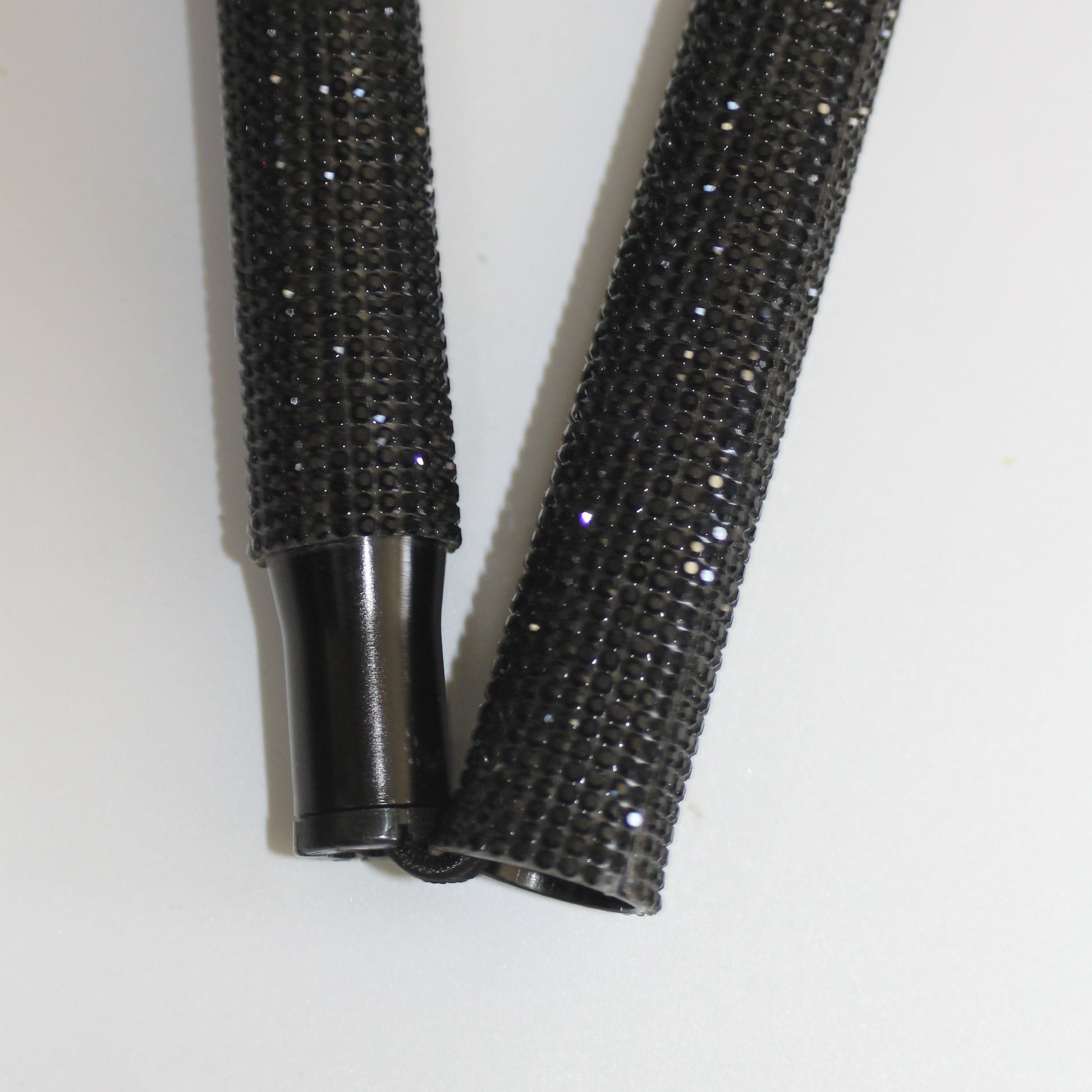 Two black textured rods 