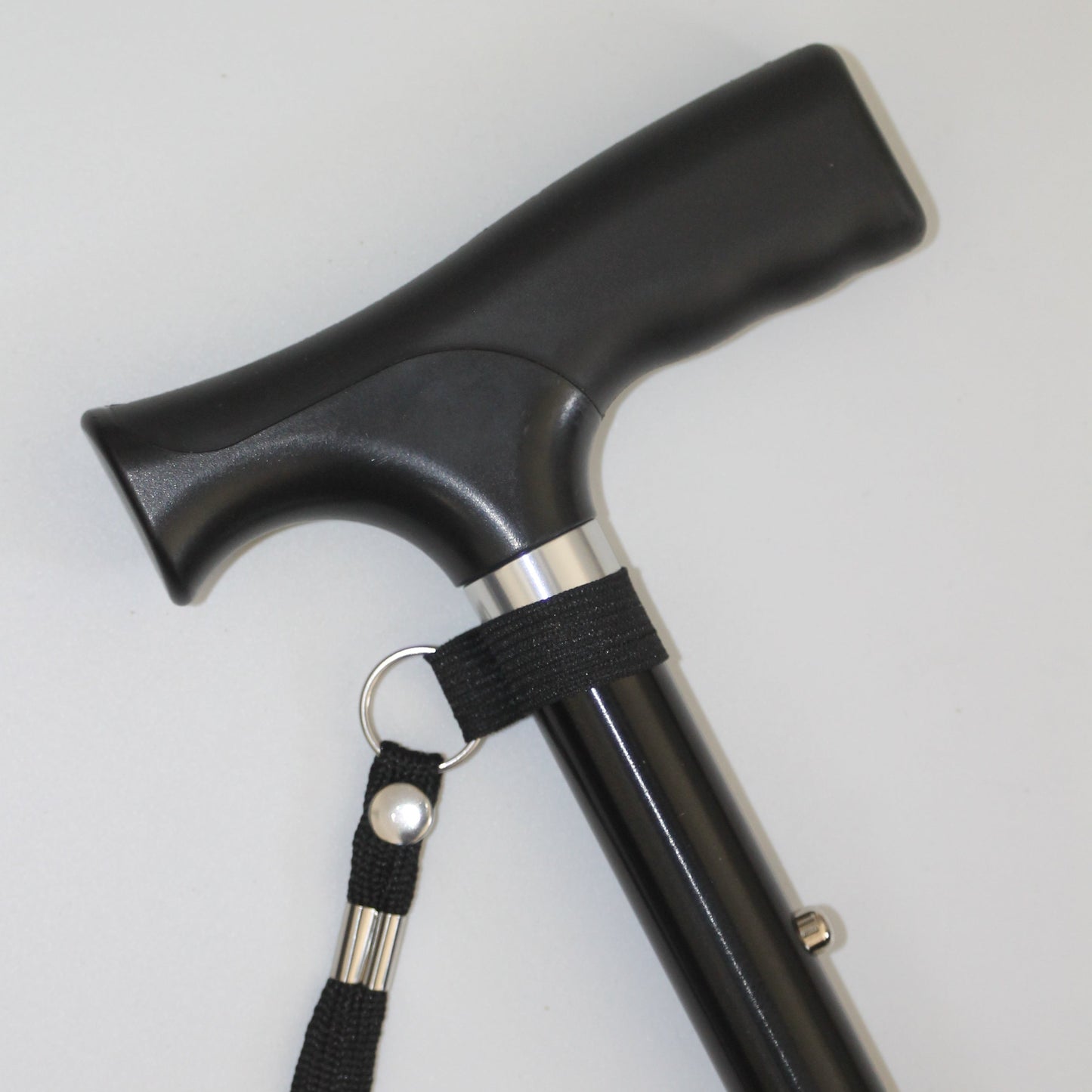 Black walking cane with a strap 